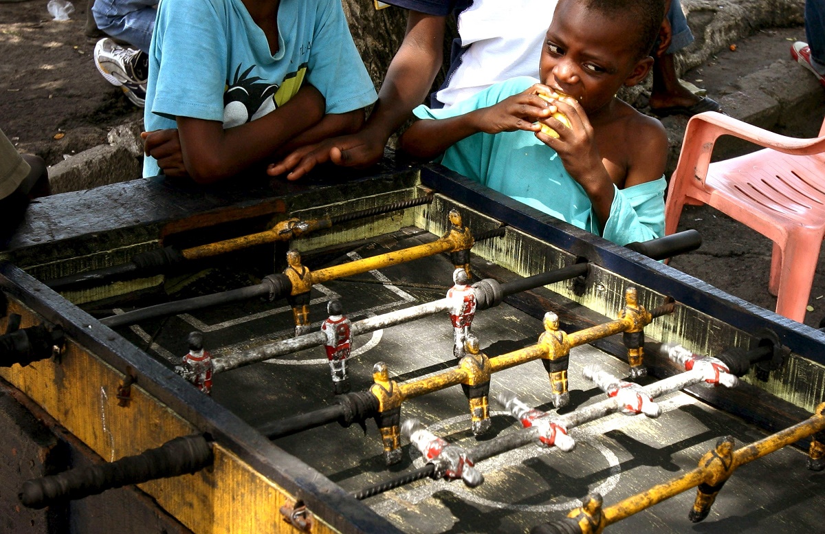  A boy watches table football as children play in the Democratic Republic of Congo's capital Kinshasa, in this November 12, 2006 file photo. – Reuters pic, March 13, 2016.