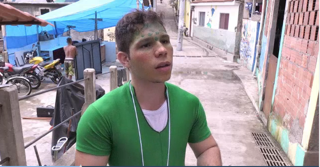 Bruno Silva de Fonseca was one of a group of story tellers and book lovers from the University of Rio de Janeiro who visited the Babilonia favela near Copacabana recently to win over residents. – AFP video screenshot, November 15, 2015.