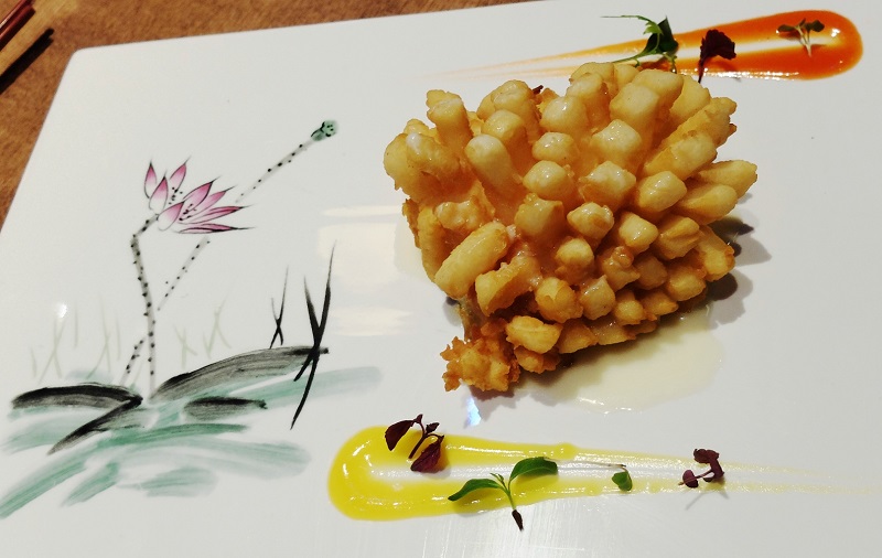 Presented beautifully, the Champagne Snowfish Flower is deepfried cod with Moet champagne sauce.