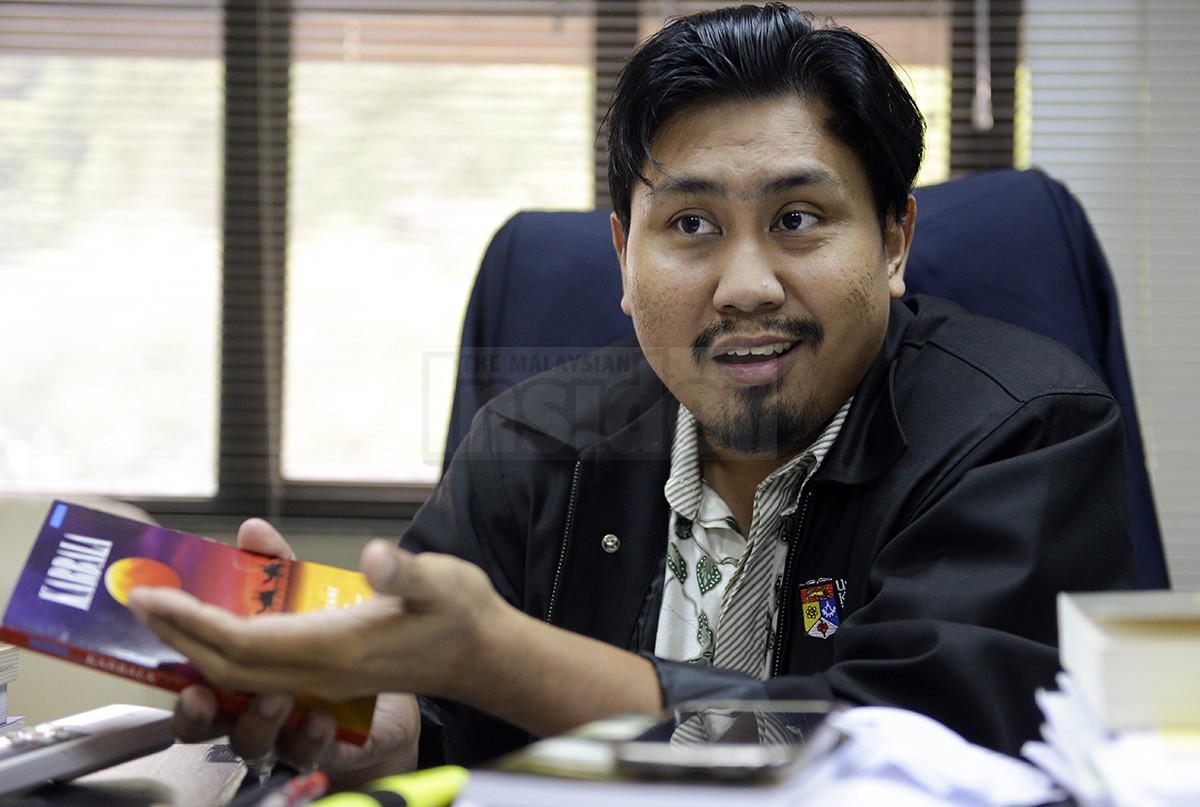 Dr Mohd Faizal Musa, who writes under the name Faisal Tehrani, is considering appealing the ban on his books, saying that parts of the books had been reproduced in Dewan Sastera and also presented at national seminars some years ago. – The Malaysian Insider pic by Nazir Sufari, May 11, 2015.