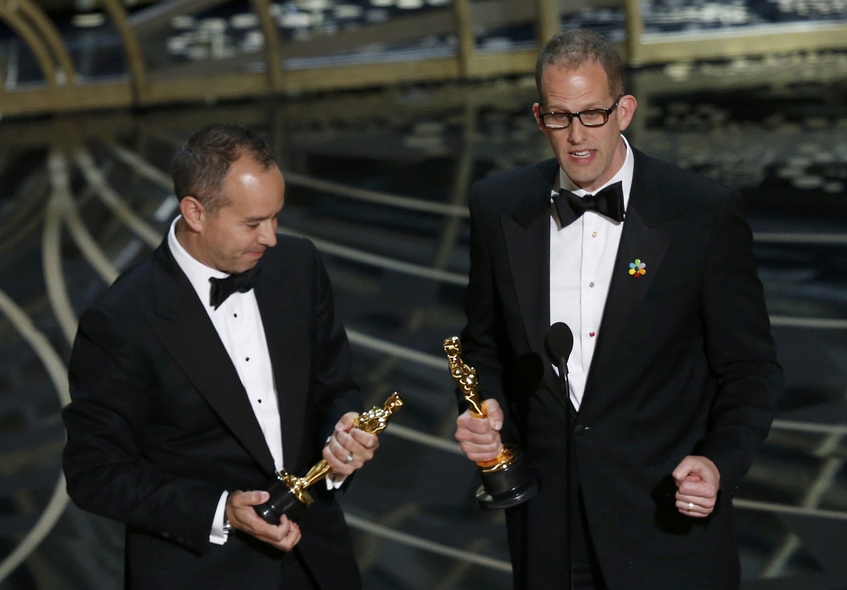 Pete Docter (right) and Jonas Rivera receive the Oscar for Best Animated Feature for 'Inside Out' at the 88th Academy Awards in Hollywood, California today.  – Reuters pic, February 29, 2016.