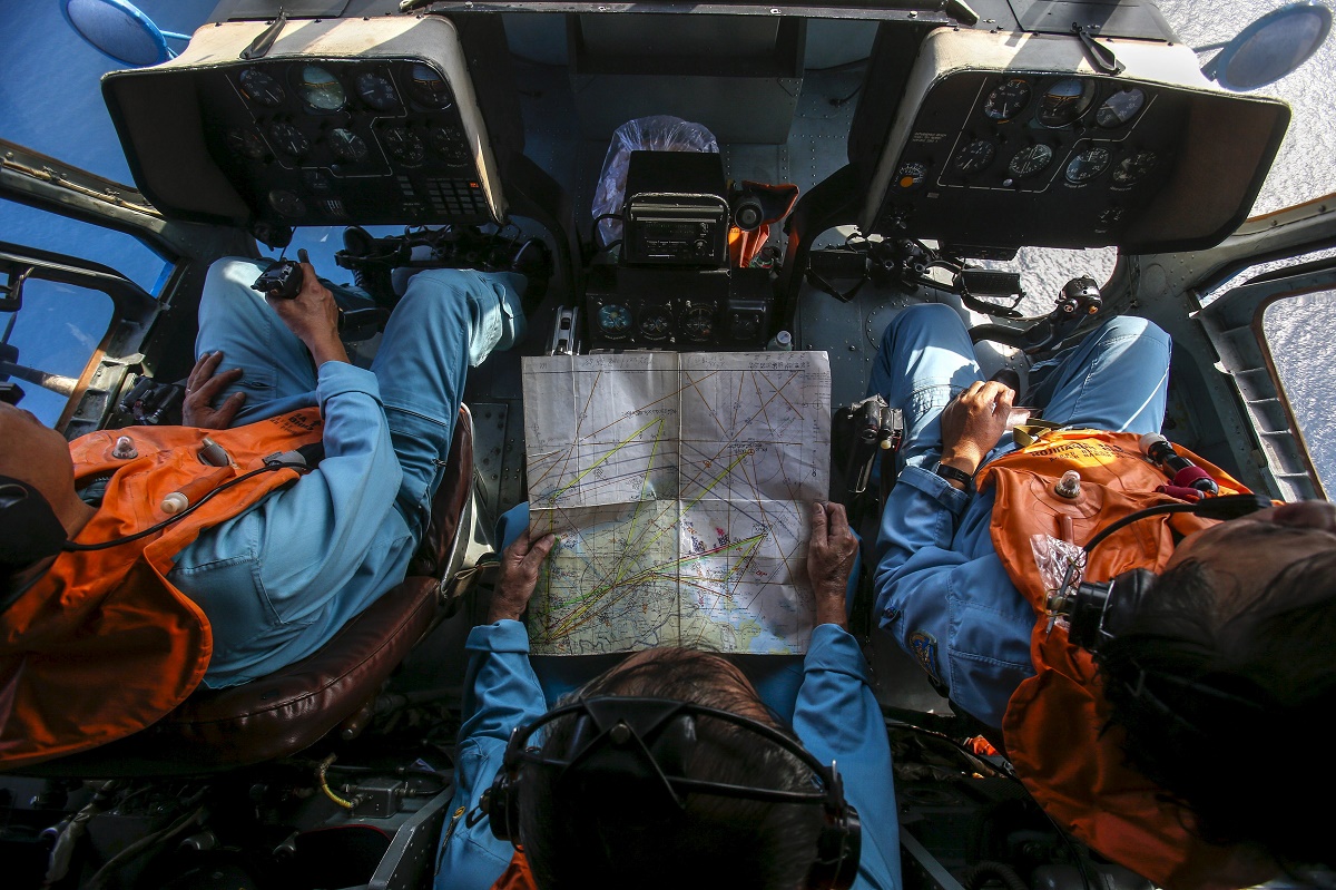 Military personnel work within the cockpit of a helicopter belonging to the Vietnamese airforce during a search and rescue mission off Vietnam's Tho Chu island March 10, 2014. A CNN commentary wrote about the advances the aviation industry has made after the disappearance of flight MH370. – Reuters pic, March 8, 2016.