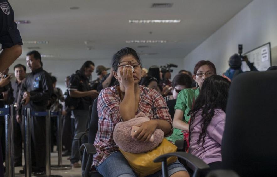 Anxious relatives waiting for news of flight QZ8051 at Juanda international airport in Surabaya in East Java, Indonesia. – AFP pic, December 28, 2014.
