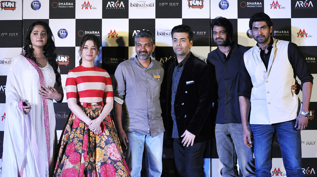 Cast members, producer and director pose for a photograph during a promotional event for the Telugu-Tamil film ‘Baahubali’, written and directed by Rajamouli (third from left) in Mumbai. – AFP pic, July 17, 2015.