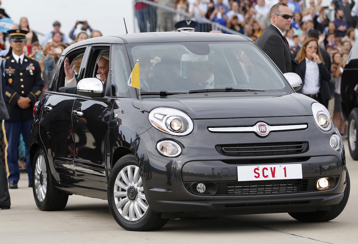 Pope Francis waves as he is driven away in a Fiat 500 model after arriving in the US at Joint Base Andrews outside Washington on September 22, 2015. The Fiat is sold at auction for US$82,000 (RM340,000), with the proceeds going to various Catholic charities. – Reuters pic, January 30, 2016.