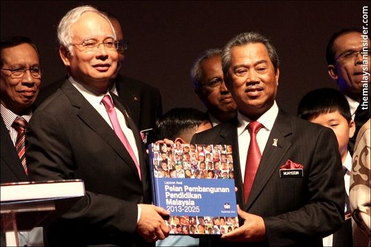 Former education minister Tan Sri Muhyiddin Yassin (right) at the launch of the Malaysian Education Blueprint (2013-2025). His replacement says there is no plan to Datuk Mahdzir Khalid to make drastic changes, but only 'improvements'. – The Malaysian Insider file pic, August 27, 2015.
