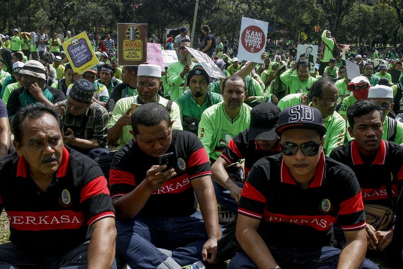 Members from Malay nationalist NGO Perkasa are seen together with other groups at the anti-TPPA protest rally in Padang Merbok listening to various speakers on the ills of the 12-nation trade pact. – The Malaysian Insider pic by Seth Akmal, January 23, 2016.