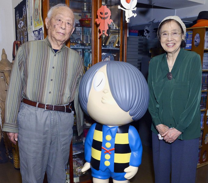 Shigeru Mizuki, a giant of Japanese manga artists (left) and his wife Nunoe Mura pose for a photo with Kitaro, the main character of his popular horror manga series 'Gegege no Kitaro' in Tokyo, in this file photo taken in May 2014. Mizuki died today at the age of 93. – Reuters pic, November 30, 2015.